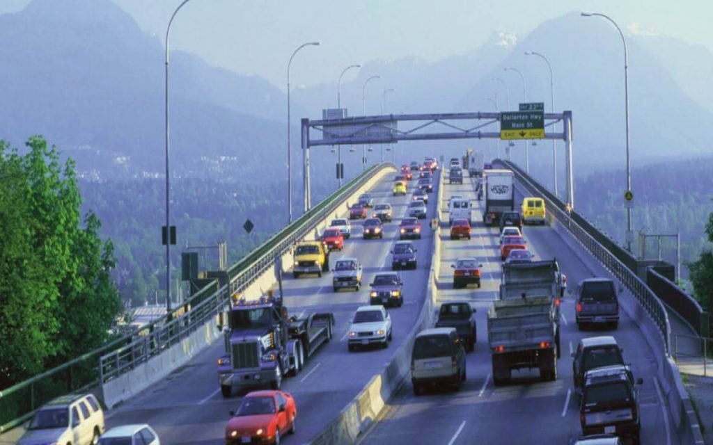 The six lanes of the Ironworker's Memorial bridge in Vancouver are full of internal combustion vehicles heading to and from the North Shore. 
